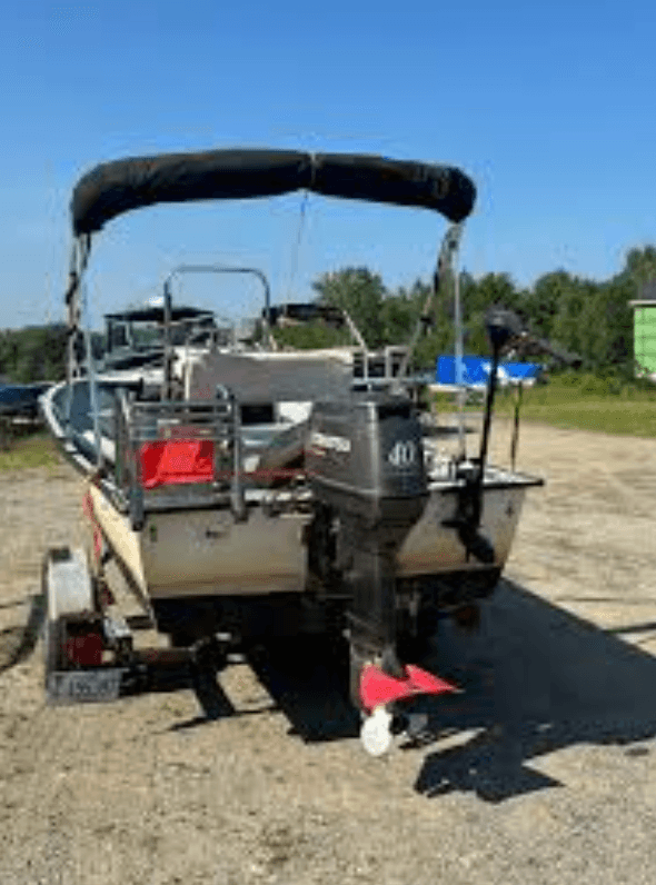 Boat with outboard motor ready for service